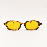Sunglasses with yellow lenses and tortoiseshell frame