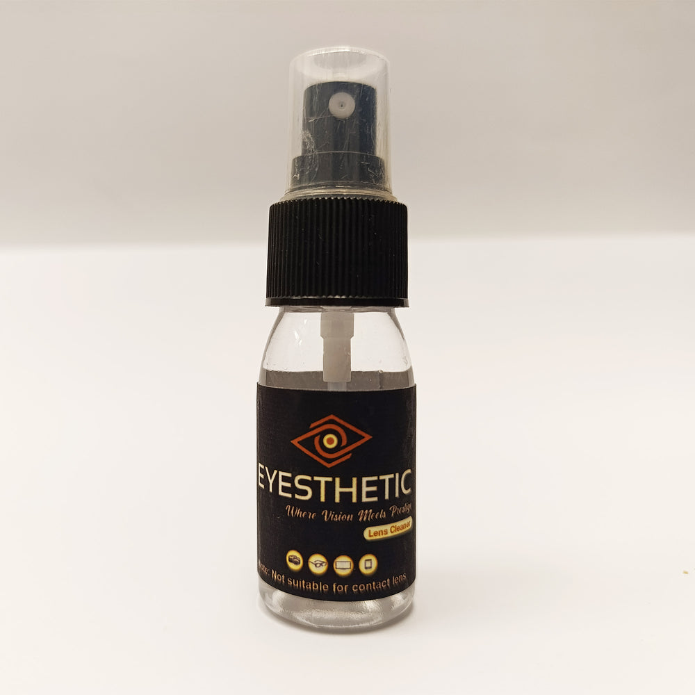 Clear spray bottle with black label on a white background